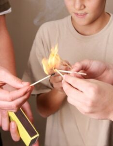 Boys playing with matches